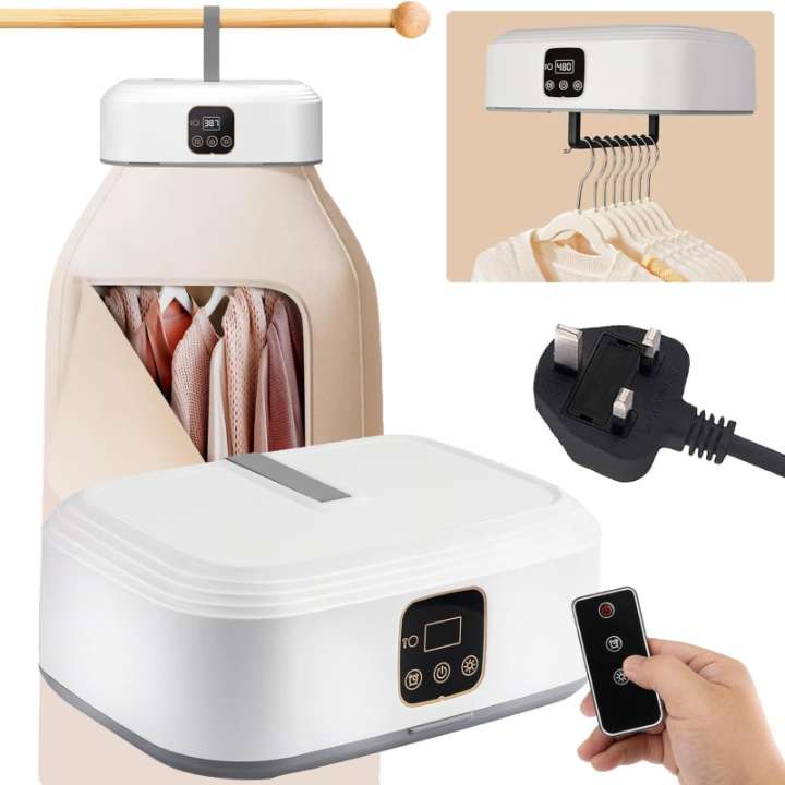 White electronic clothes dryer with remote control, power plug, and hanging clothes on a beige background.