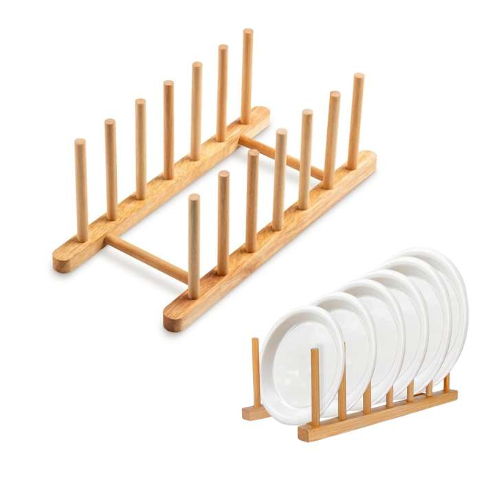 A natural bamboo plate drying rack shown empty and holding several white plates, on a clean white background.