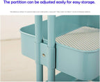 Modern minimalist black metal kitchen trolley with wooden handle, on wheels, holding kitchen accessories and utensils.