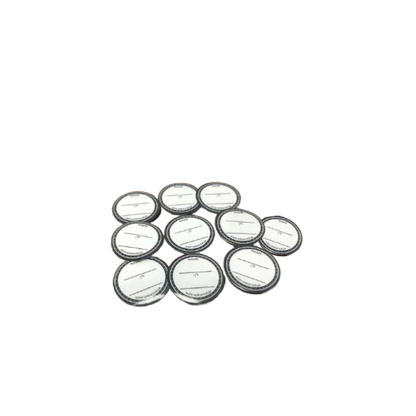 Set of round metallic buttons on a white background