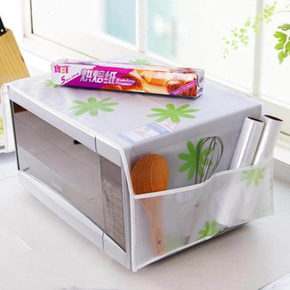 White storage bench with green floral design on a white surface, featuring kitchen utensils and a box.