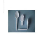 Set of plastic cutlery including a spoon, fork, and knife on a blue background