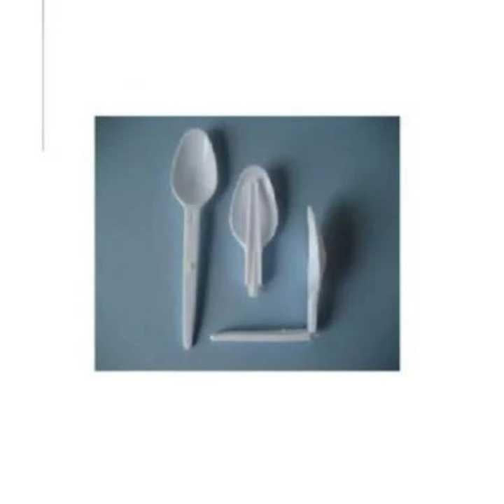 Set of plastic cutlery including a spoon, fork, and knife on a blue background