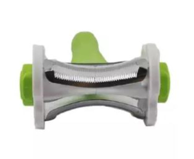 Hand holding a silver stainless steel multi-function peeler with a black ergonomic handle, shown peeling a long strip from a carrot over a cutting board.