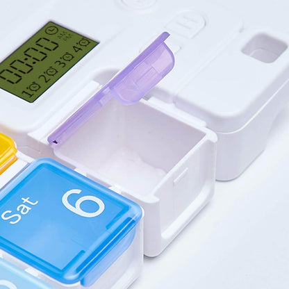 Multicolored pill organizer with digital display on a white background