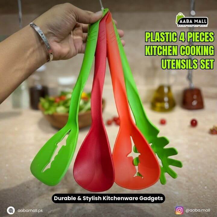 Three colorful kitchen utensils held by a hand with a blurred kitchen background.