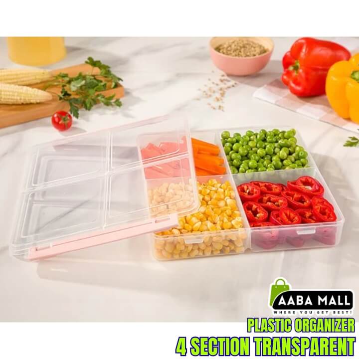 Transparent plastic organizer with compartments filled with vegetables on a table with food items.