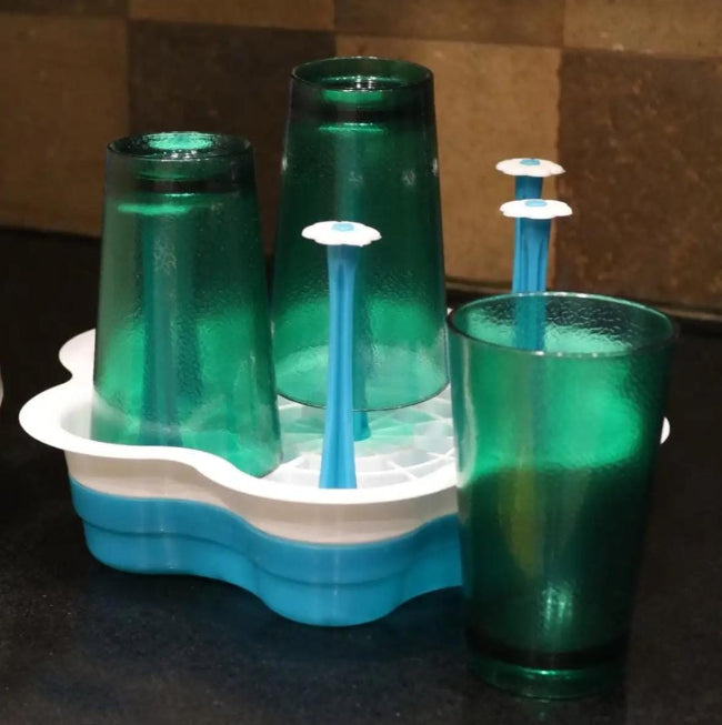 Set of 6 green 300ML self-designed plastic tumblers on a wooden table, showing the ribbed glass-look texture and the drinkware's shatterproof material.