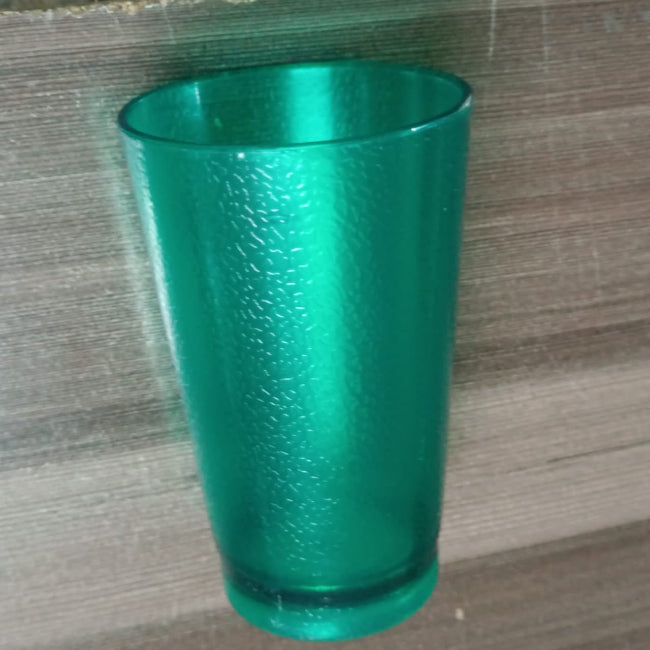 Set of 6 green 300ML self-designed plastic tumblers on a wooden table, showing the ribbed glass-look texture and the drinkware's shatterproof material.