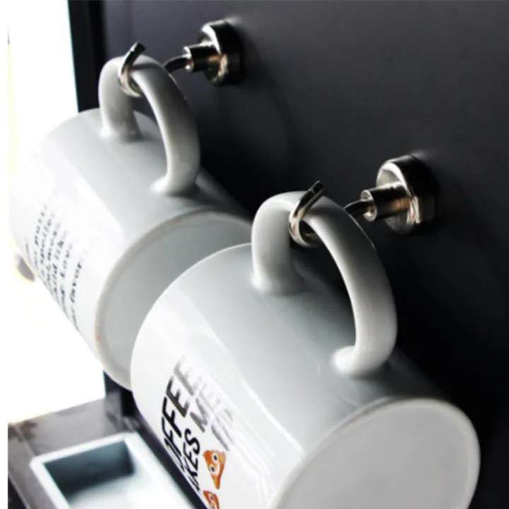 Three gray mugs with handles attached to a blackboard, featuring 'Coffee' branding.