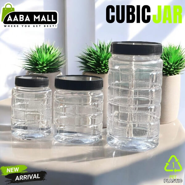 Clear cubic jars with black lids on a white surface with plants in the background, featuring Aaba Mall branding.