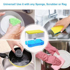 A white plastic push soap dispenser with a clear reservoir, showing a yellow scrub sponge resting on top of the pump mechanism, positioned next to a kitchen sink.