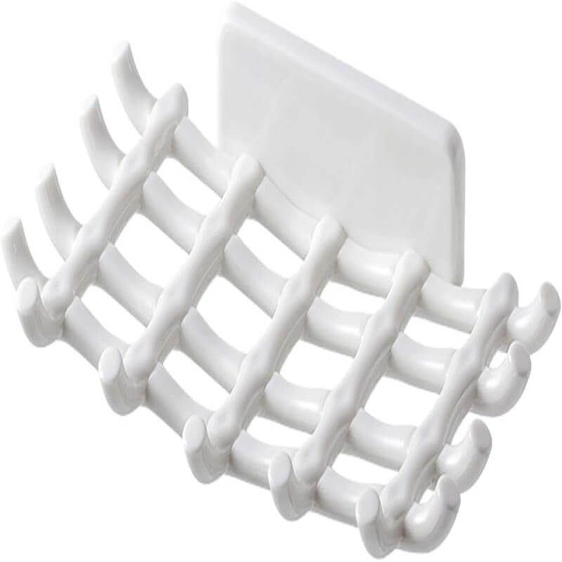 White plastic grid with multiple hooks on a white background