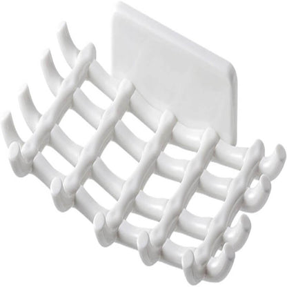 White plastic grid with multiple hooks on a white background