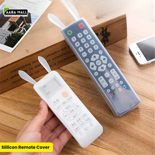 Two semi-transparent silicone remote control covers with cute rabbit ears, one on a white AC remote and one on a black TV remote,  'AABA MALL' branding.