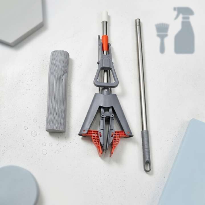Cleaning tool set with gray and red components on a light surface