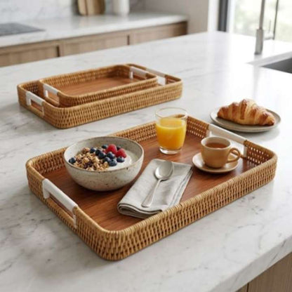 Wooden tray with breakfast items on a marble countertop
