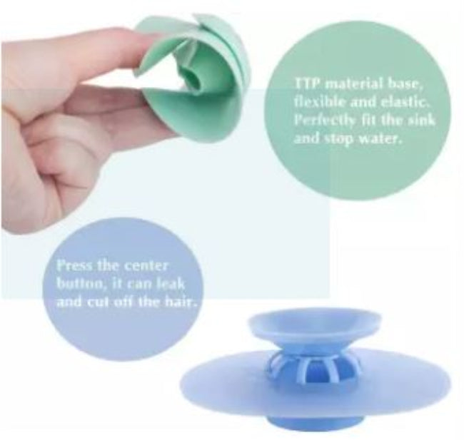 Silicone drain strainer hair catcher and water stopper in grey, shown placed in a bathtub drain in the filter mode, catching hair while water is running.