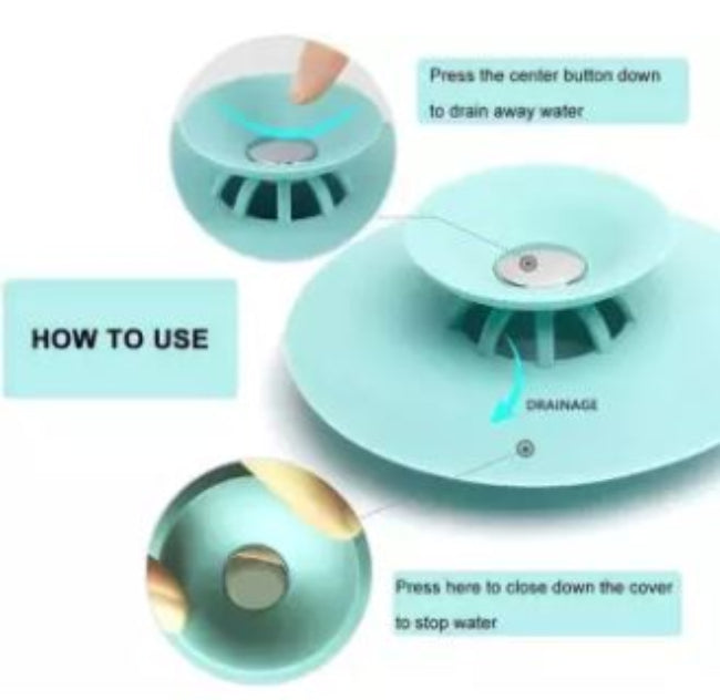 Silicone drain strainer hair catcher and water stopper in grey, shown placed in a bathtub drain in the filter mode, catching hair while water is running.
