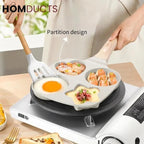 Multifunctional cooking pan with partition design on a stove, featuring eggs and food.