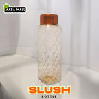 Large 1500ml premium plastic water bottle with a frosted slush-style finish, shown filled with water on a gym bench, highlighting the easy-carry handle.
