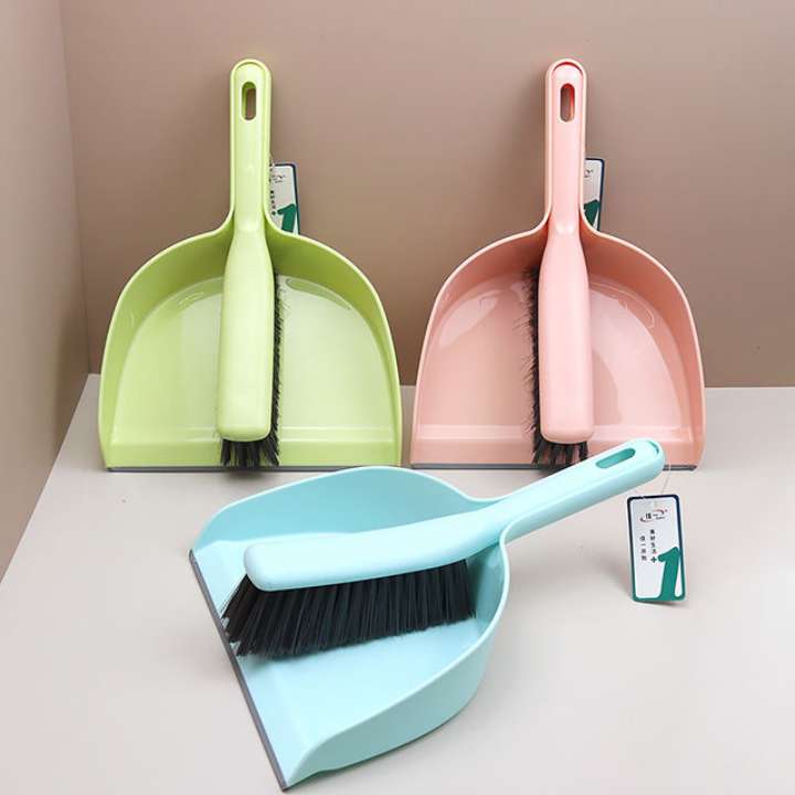 Three colorful dustpan and brush sets on a light surface with a neutral background AABA MALL 