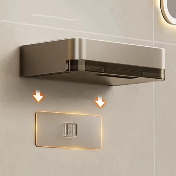 Metallic wall-mounted light fixture on a tiled wall