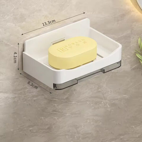 White soap dish with a yellow bar of soap on a gray surface