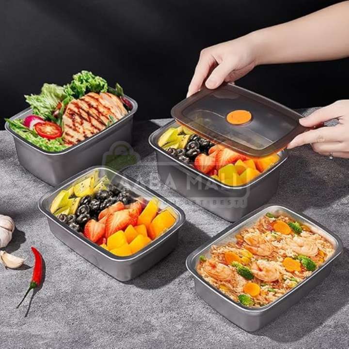 Set of food containers with various meals on a gray surface