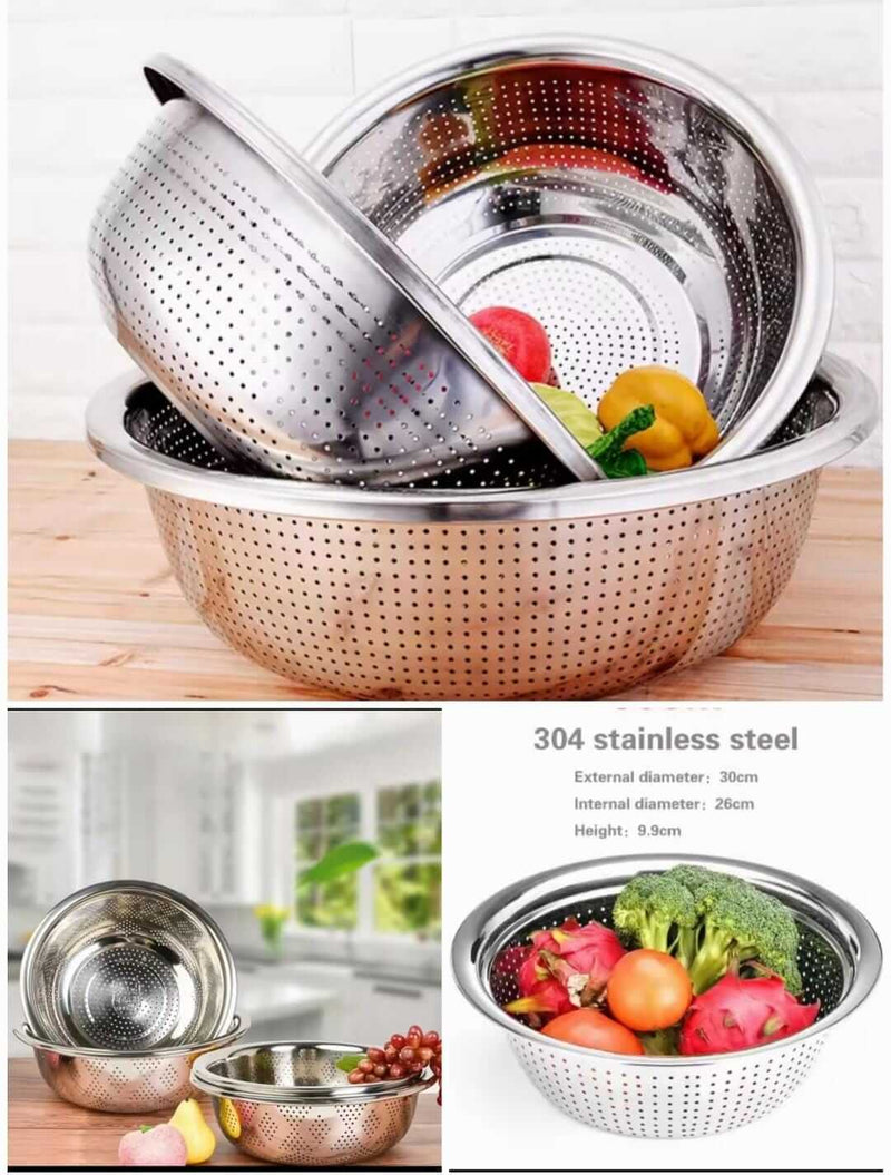 Stainless steel colander with vegetables on a wooden surface