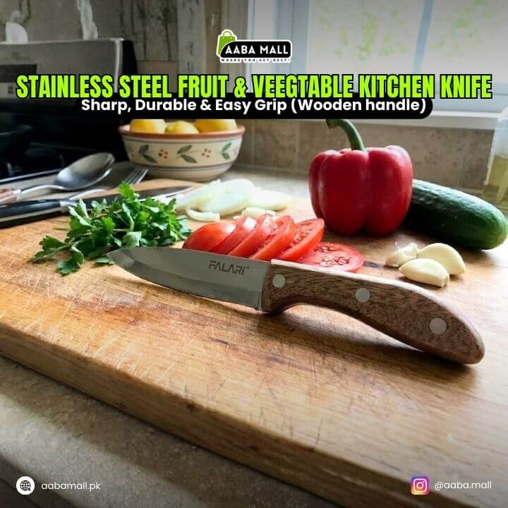 Kitchen knife with wooden handle on a cutting board with vegetables, branded as AABA MALL.