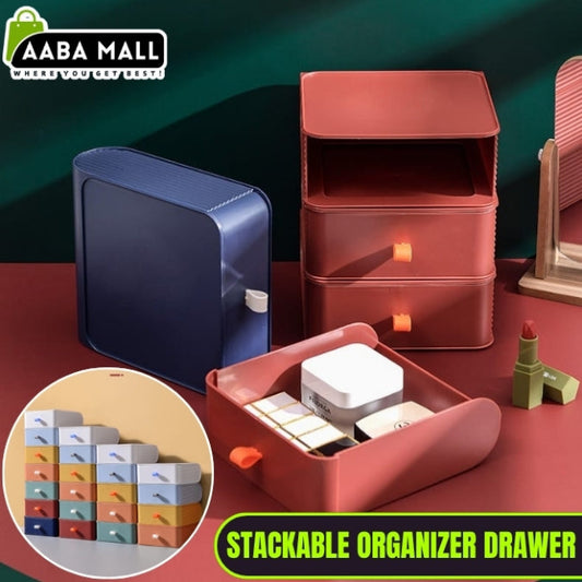 Set of clear stackable plastic drawer organizer boxes, one filled with makeup products and another with jewelry, shown neatly stored on a vanity desk.