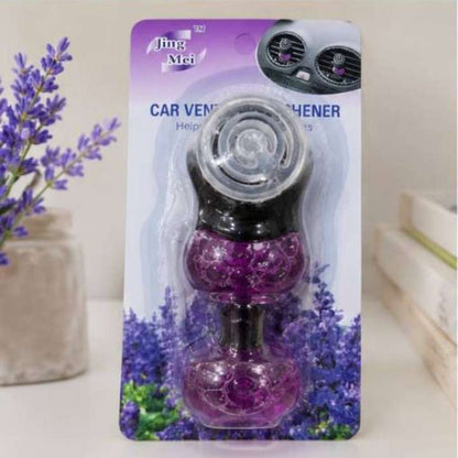 Jing Mei car vent air freshener in purple and black, packaged on a purple and lavender card, with decorative lavender flowers and books in the background.