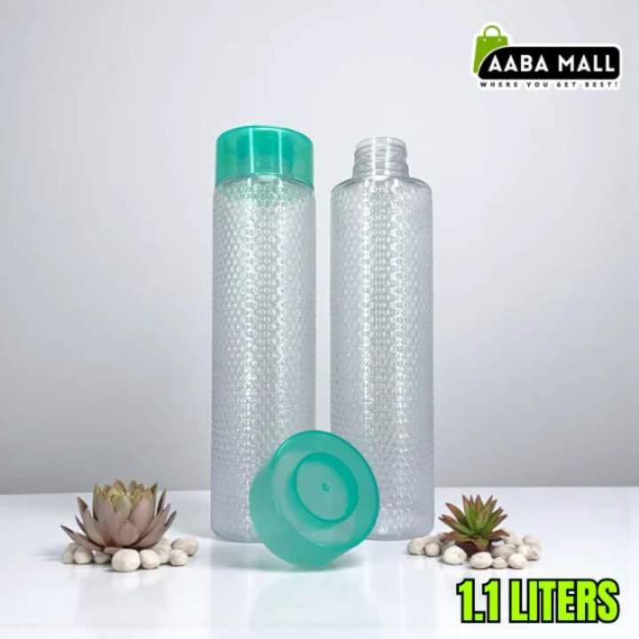 Two plastic bottles with green caps on a white surface, featuring the Aaba Mall logo.