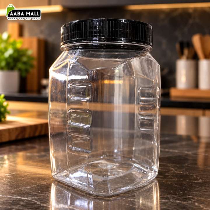 A clear plastic hexagonal storage jar with a ribbed black screw-on lid, shown on a dark kitchen countertop with a blurred kitchen background. An 'AABA MALL' logo is visible in the top-left corner.