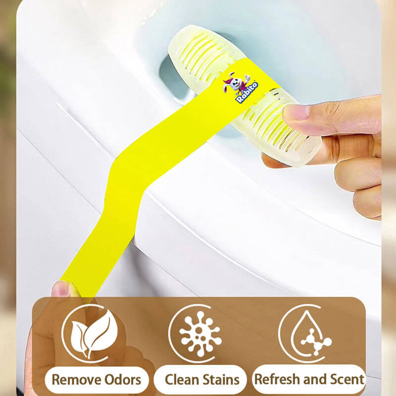 Hand holding a yellow cleaning brush with a brand logo, against a blurred background.