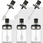 Set of four glass bottles with black and silver lids and attachments on a white background