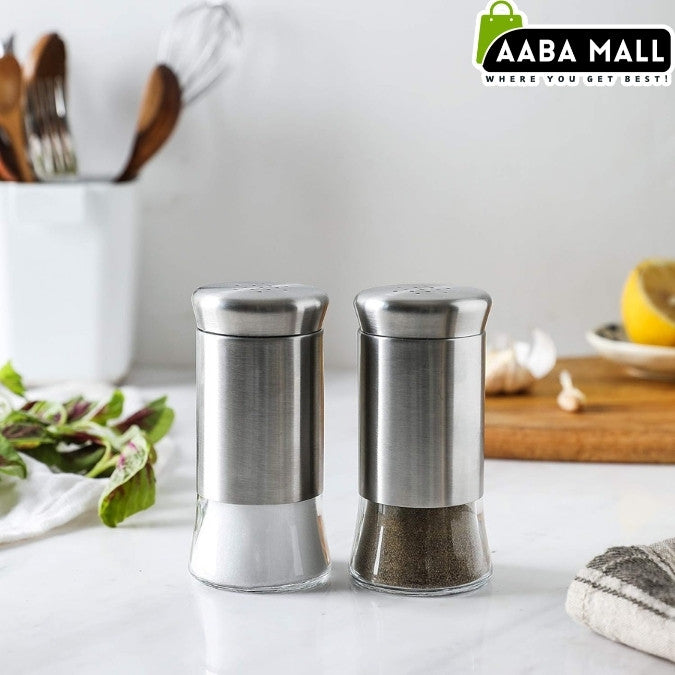Two stainless steel salt and pepper shakers on a kitchen counter with Aaba Mall branding.