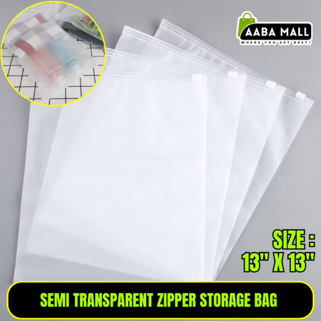 Close-up of a semi-transparent, thickened plastic zipper storage bag filled with folded sweaters, showing the smooth zipper and dustproof material in a closet.
