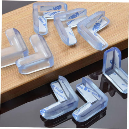 Clear plastic corner protectors on a wooden surface