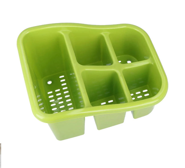 Plastic cutlery holder drainer caddy with multiple compartments, organizing kitchen utensils and tools on a countertop