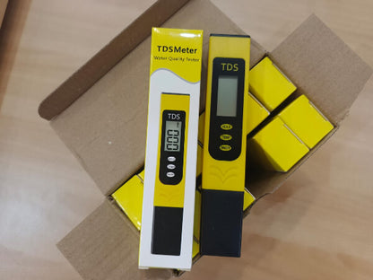 TDS meter with packaging on a cardboard surface