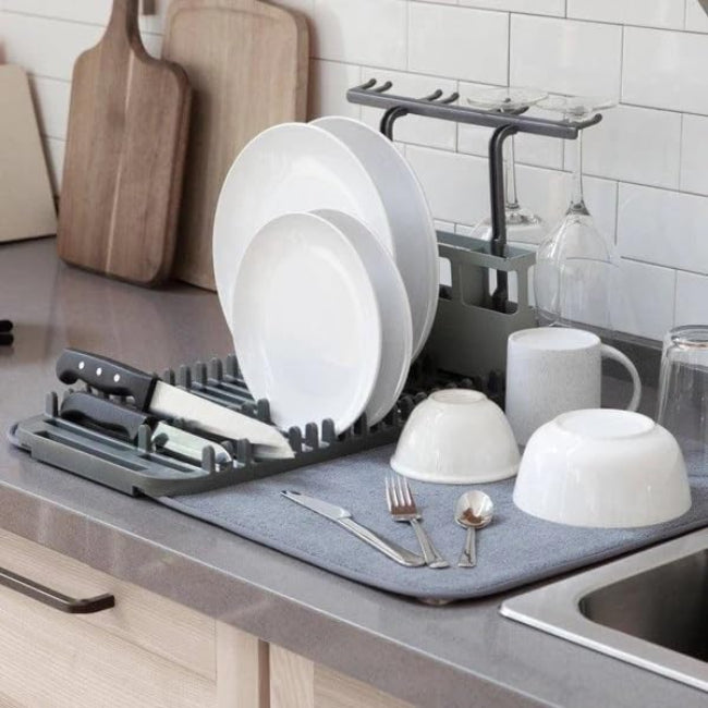 A 2-in-1 compact dish drying system showing a small white dish rack resting on a gray microfiber drying mat (44x20cm size) on a kitchen counter.
