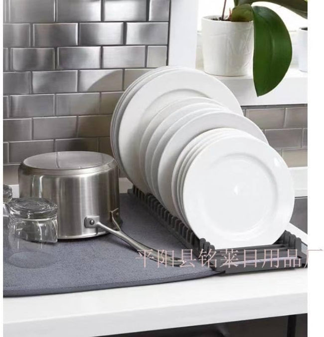 A 2-in-1 compact dish drying system showing a small white dish rack resting on a gray microfiber drying mat (44x20cm size) on a kitchen counter.