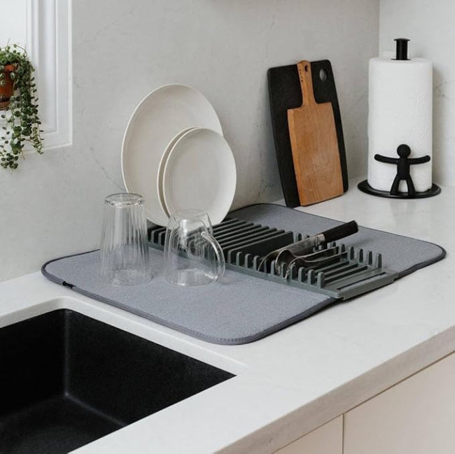 A 2-in-1 compact dish drying system showing a small white dish rack resting on a gray microfiber drying mat (44x20cm size) on a kitchen counter.