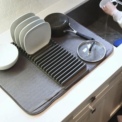 A 2-in-1 compact dish drying system showing a small white dish rack resting on a gray microfiber drying mat (44x20cm size) on a kitchen counter.