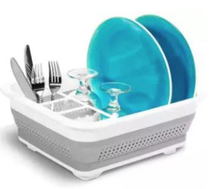A blue collapsible silicone dish tub shown fully expanded, with the sides popped up to form a portable dish drying rack for camping and RV use.