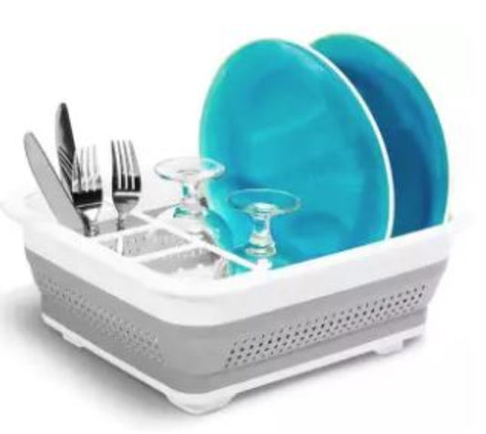A blue collapsible silicone dish tub shown fully expanded, with the sides popped up to form a portable dish drying rack for camping and RV use.