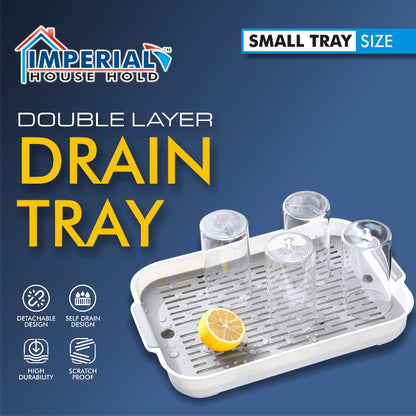 Double-layer plastic drain tray with perforated top layer and anti-slip base, used for drying sponges and kitchen tools