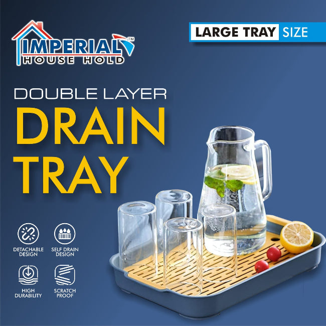 Double-layer plastic drain tray with perforated top layer and anti-slip base, used for drying sponges and kitchen tools